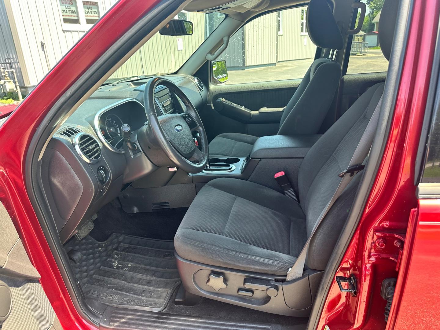 2009 Red /black Ford Explorer XLT (1FMEU73E89U) with an 4.0L V6 engine, 5-Speed Automatic transmission, located at 11115 Chardon Rd. , Chardon, OH, 44024, (440) 214-9705, 41.580246, -81.241943 - This 2009 Ford Explorer is a reliable and capable SUV, offering a 4.0L V6 engine paired with a 5-speed automatic transmission and full-time 4WD system. With a 3,500-pound towing capacity, it's suitable for moderate hauling needs. Additionally, the power driver's seat provides comfort and convenience - Photo#12